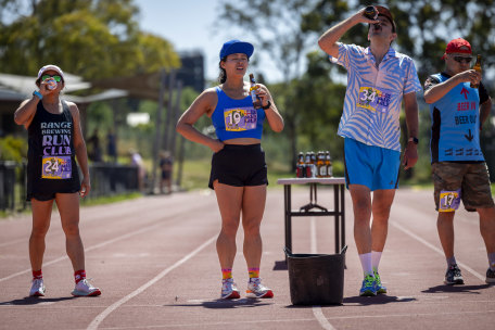 Determined to finish: Adeline Teh, in blue cap, overcame queasiness to finish her race.