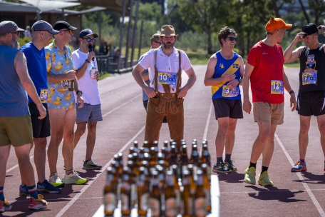 Here for beer and running: Benny Reyn, dressed in lederhosen, lines up for his beer mile race.