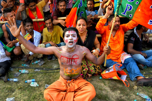 A man shows his support for Narendra Modi's party at a mass rally in Kolkata in April.