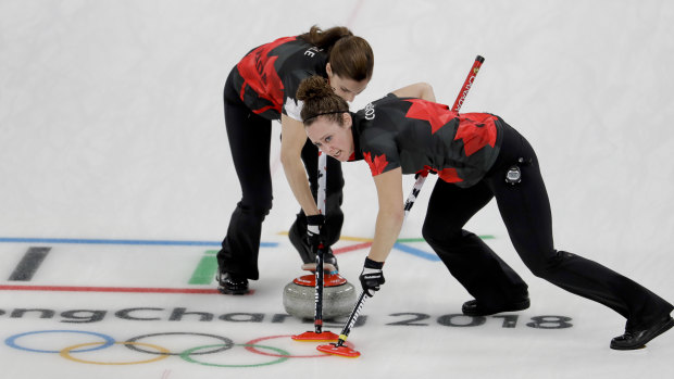 Canadian Joanne Courtney (right) is one of the strongest sweepers in the world.