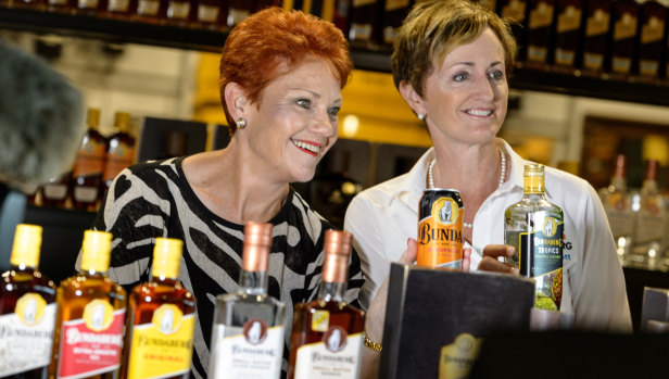 One Nation leader Senator Pauline Hanson (left) and Bundaberg candidate Jane Truscott are seen in the Bundaberg Rum Distillery.