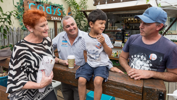 One Nation leader Pauline Hanson with Damian Huxham, Cody Stevens, 4, and Cody's father, Troy Stevens in Hervey Bay.