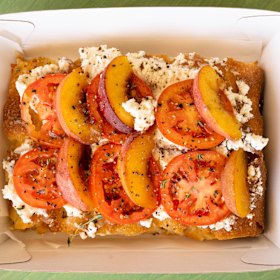 Breakfast focaccia with ricotta, tomatoes and peaches. 