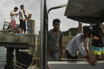 Chinese tourists wait to board a ferry from Koh Rong Island.