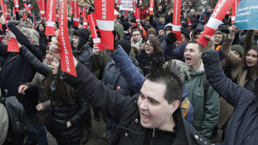 Protesters shout slogans during a rally holding posters reading 'Navalny 2018' against Russia's Central Election Commission's decision to ban the opposition leader Alexei Navalny presidential candidacy.