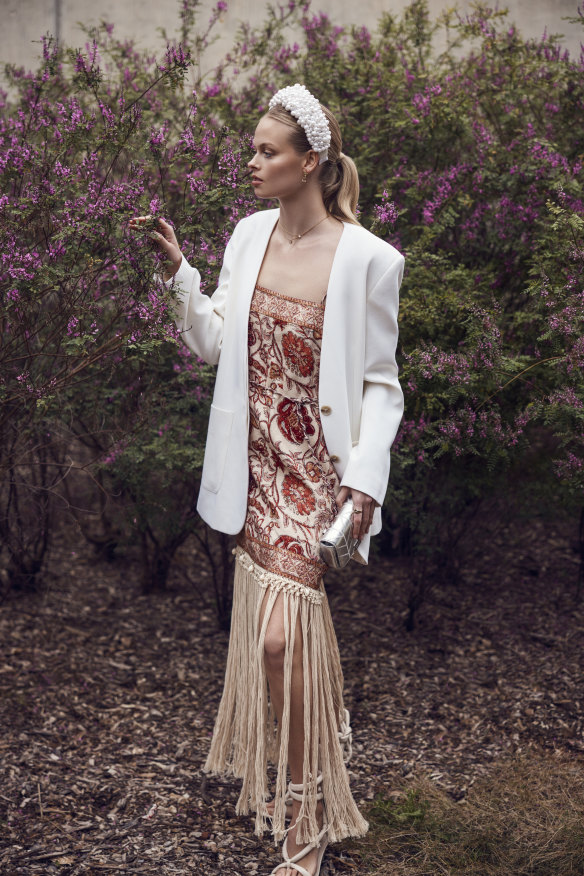 Zimmermann Vitali mini dress, $850; Beare Park blazer, $1050; Gregory Ladner headband, $200, from David Jones; Natasha Schweitzer quartz ear jacket, $1400; Futurae Diamonds “Elio” Solitaire lab-grown diamond necklace, $2400,  and “Lucille” lab-grown diamond pendant necklace 18ct yellow gold, $2400; Claudie Pierlot quilted clutch, $490; Aristides Fine Jewels “Deca” diamond eternity ring in yellow gold, $3250; Alias Mae sandals, $230.