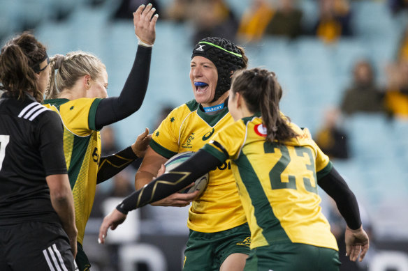 Reward for effort: Alisha Hewett finishes an excellent team try for Australia to gain some consolation.