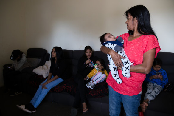 Lee-Anne Ebsworth with her grandson, Gordon, in her mother's public housing home  in Dubbo. 