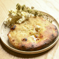 Pita, cooked in Tzaki’s wood oven, is served with feta butter.