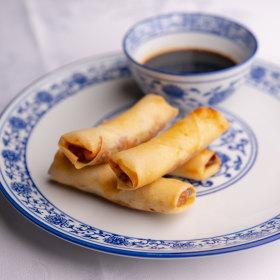 Lobster and scallop spring rolls with vinegar sauce.