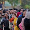 Voters line up to cast their ballots at a polling station in Naypyitaw, Myanmar.
