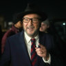 Workers Party of Britain candidate George Galloway celebrates with supporters at his campaign headquarters after being declared the winner in the Rochdale by-election.