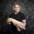 Chef Adrian Richardson with his suckling pig. He will no longer be able to get these suckling pigs.
