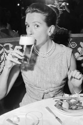 Actress Deborah Kerr drinks a beer at lunch at Romano’s in Sydney on October 13, 1959. She was in Australia for the filming of The Sundowners. 
