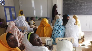Children displaced by Boko Haram during an attack on their villages receive lectures in a school in Maiduguri, Nigeria in 2015. More young women have gone missing. 