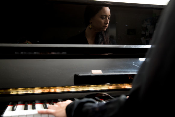 Screen composer Caitlin Yeo at the piano in her Marrickville home.