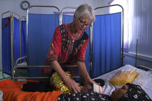 Kate Edmonds attends Fatima, 25, and her hours old baby at the Medecins Sans Frontieres hospital in Kutupalong Camp.