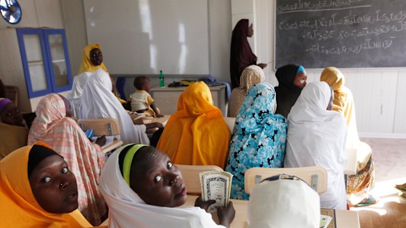 Children displaced by Boko Haram during an attack on their villages receive lectures in a school in Maiduguri, Nigeria in 2015. More young women have gone missing. 