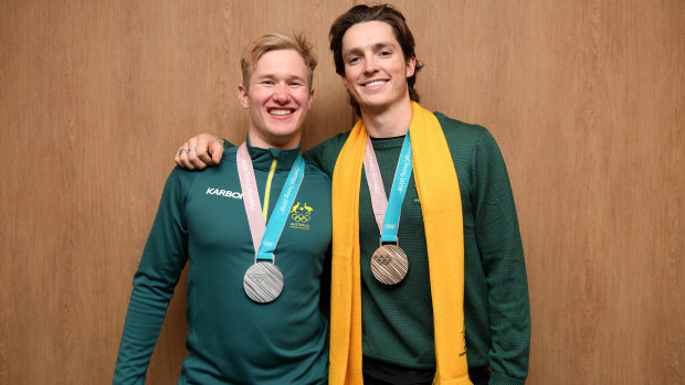 Snowboarders Jarryd Hughes and Scotty James with their Olympic medals.