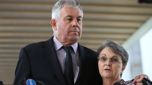 Slain Queensland man Timothy Pullen's parents Gary and Leanne Pullen speak to the media outside the Brisbane Magistrates Court in Brisbane on Friday.