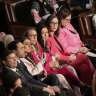 Democratic members of Congress wear pink to protest Donald Trump during his address to Congress.