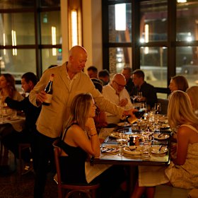 The restaurant sits on a sweeping corner of the hotel’s ground floor.