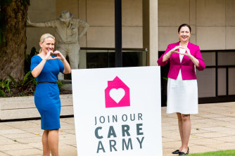 Then-innovation minister Kate Jones and Premier Annastacia Palaszczuk launching the “care army” last year.