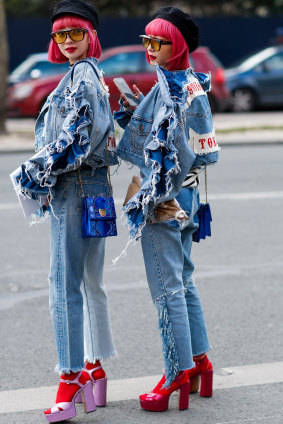 Street style twins Ami and Aya Suzuki arriving at the Dior show at Paris Fashion Week.