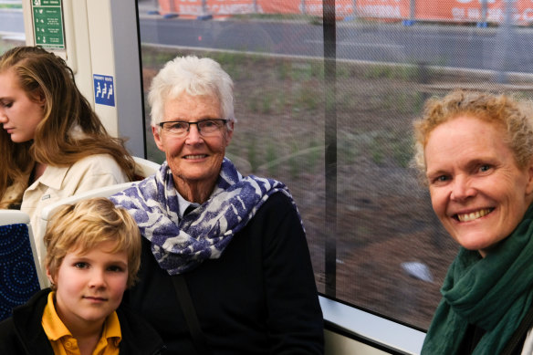 Margaret Langford (centre) with her grandson and daughter Kate Langford, (right).