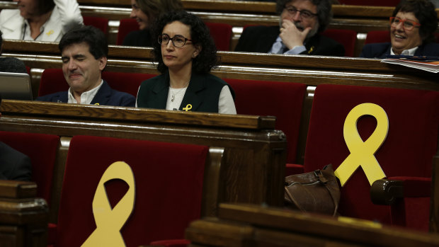 Yellow ribbons in support of Catalonian politicians who have been jailed on charges of sedition are displayed before a parliamentary session in Barcelona.