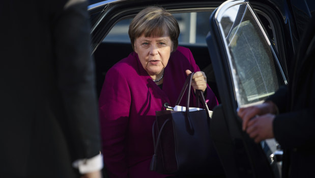 German Chancellor Angela Merkel arrives for  coalition talks between her Christian Democratic bloc and the Social Democratic party at the CDU headquarters in Berlin on  Tuesday.