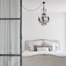 Steel-framed glass doors replaced a wall between the sitting room and bedroom. 
