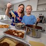 Dinner’s ready: Andrea Ruff and her son Joshua make lasagna for strangers who need a free meal.