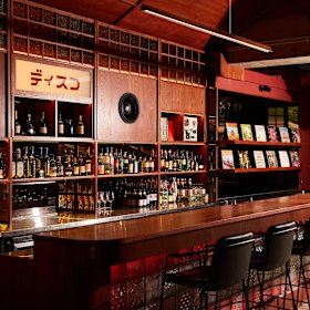 Upon entering the revamped bar, a cluster of disco balls speaks to the all-vinyl soundtrack.