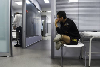 Abdalrahman, 18, from Mosul in Iraq, watches Najm Alden, from Aleppo in Syria, 50, try out his new prosthetic leg.