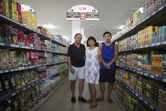 Business owners Richard and Rosemary Lo - pictured with son Mathew - have noticed a shift in sentiment.