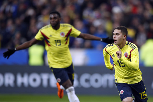 Colombia's Juan Fernando Quintero, right, celebrates his side's 3rd goal against France.