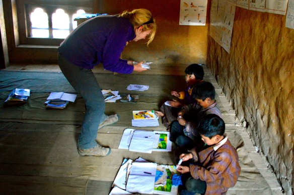Ms McNeice helps teach Bhutanese children.