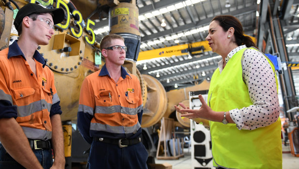 The Premier chats to young apprentices as she visits the Hastings Deering workshop in Mackay.
