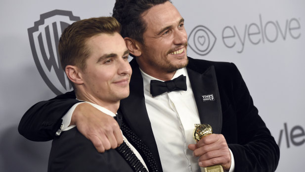 James Franco, right, and Dave Franco with the former's best actor award at the Golden Globes in January.