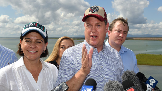 Mr Nicholls (right) and LNP deputy leader Deb Frecklington (left) hold a press conference at the Ross River Dam.