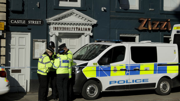 Police officers outside a restaurant in Salisbury, England, where traces of a nerve agent have been found. 
