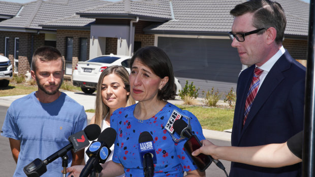 NSW Premier Gladys Berejiklian and NSW Treasurer Dominic Perrottet speaking in Oran Park, western Sydney,  on Sunday. 