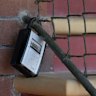 The international symbol of an unhosted short-term stay, a key lock box, in front of a home in Millers Point, Sydney.