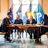 From right to left: First Peoples’ Assembly co-chair Rueben Berg, Premier Jacinta Allan, Minister for Treaty Natalie Hutchinson and assembly co-chair Ngarra Murray sign Victoria’s statewide treaty at Government House.