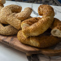 Stacks of simit, a sesame-studded bread ring that is a popular Turkish street food.