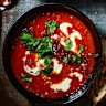 Creamy chipotle-tomato soup with crispy chorizo and toasted seeds.