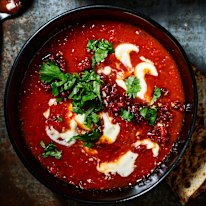 Creamy chipotle-tomato soup with crispy chorizo and toasted seeds.