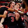 Josh Giddey #3 of the Chicago Bulls celebrates with teammates after hitting a game-winning three pointer against the LA Lakers.
