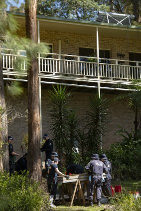 NSW Police search the gardens below a balcony at the home from which William Tyrrell disappeared.